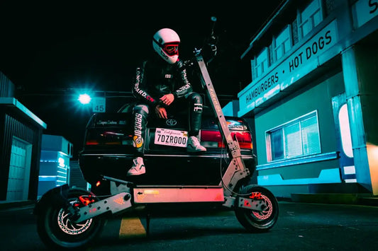 Kukirin G4 silver heavy-duty off-road electric scooter, cyberpunk neon night street with rider sitting on vintage sedan.